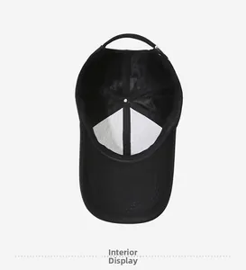 Interior view of black baseball cap showing reinforced stitching and breathable mesh detail