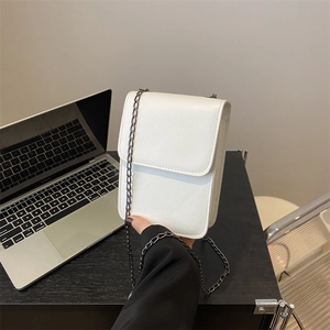 Chic white leather vertical crossbody phone bag with sleek dark metal chain strap