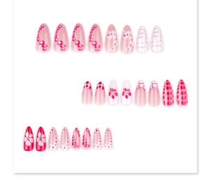 Detail of 24 short almond press on nails with floral patterns, polka dots and rhinestones