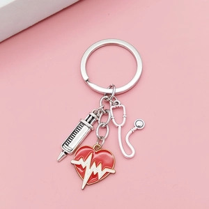 Medical keychain with syringe, stethoscope, and red heart pendant for nurses and doctors