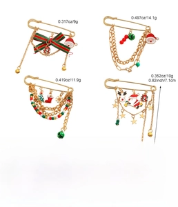 Detailed view of zinc alloy Christmas brooches with Santa and bell charms