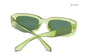 Rear view of trendy rectangular wide-frame sunglasses in translucent green resin
