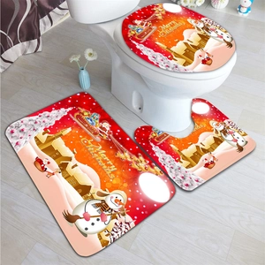Detail of Christmas themed non-slip bathroom mats with Santa and snowman patterns