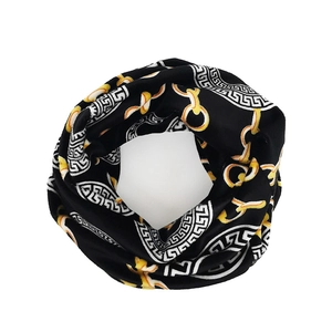 Versatile black neck gaiter scarf featuring gold chain patterns and Greek Key motifs