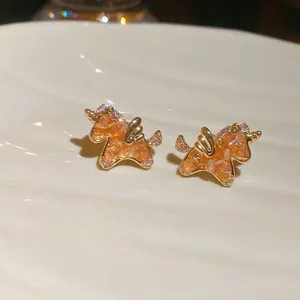 18k gold plated unicorn stud earrings featuring orange crystals and white zircons