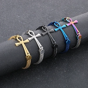 Detail of Ankh cross bracelets in gold, silver, black and blue stainless steel finish