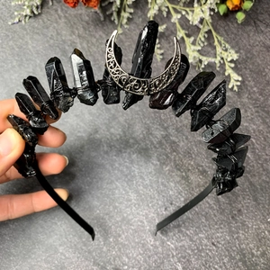 Handmade black crystal crown headband featuring a silver crescent moon and sleek metal base