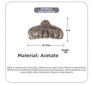 Macro detail of large acetate hair claw clip with shell pattern and exact dimensions