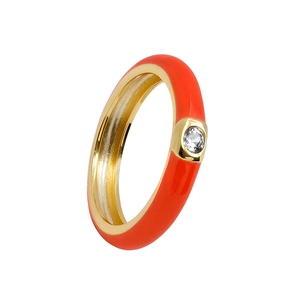 Detailed macro view of orange enamel gold ring featuring a sparkling zircon stone inlay