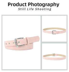 Close-up of pink matte PU leather belt with silver pin buckle and metal eyelet details