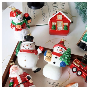Set of glossy Christmas ornaments featuring Santa and a red train on vintage background