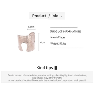 Detail view of wide rose gold cuff bracelet with hammered texture and dimensions