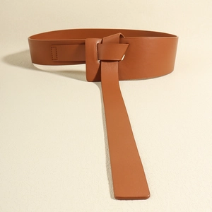 Wide brown leather waist belt with elegant knot design for women's dresses and coats