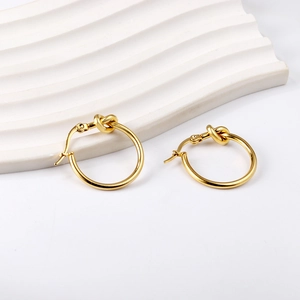 Elegant gold knot hoop earrings for women in a minimalist polished stainless steel design