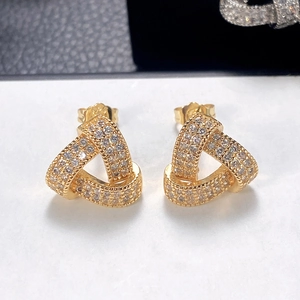 Close-up of geometric S925 sterling silver triangle earrings with pave crystal inlay