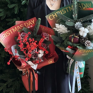 Christmas bouquet gift wrapping paper with gold stamping and pine needles in red and green