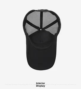 Internal detail of black mesh trucker hat showing breathable structure and stitching