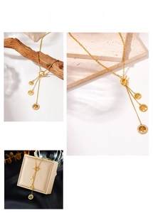 Detail of gold tree of life pendant with crystals and OT toggle clasp closure