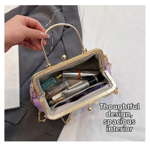 Internal view of purple floral handbag showing capacity for phone and cosmetics