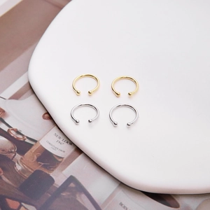 Minimalist S925 sterling silver ear cuffs in gold and silver finish on ceramic tray