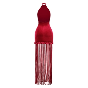 Detail of red velvet halter dress featuring long fringe hem and backless silhouette