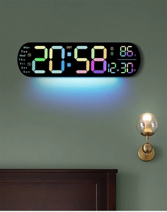 Detail of colorful LED digital wall clock displaying time, date and ambient light feature