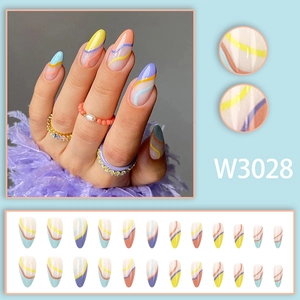 Detailed view of almond-shaped press-on nails with colorful macaron wave line designs