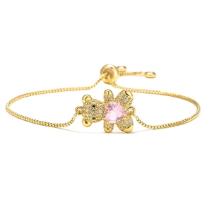 Detail of golden bear charm with pink heart zirconia and adjustable slider chain