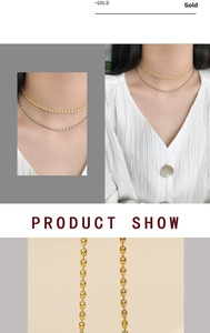 Macro detail of 18K gold plated double layer bead chain necklace for women