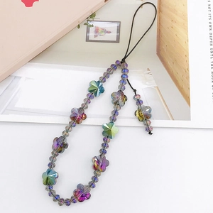 Detailed shot of beaded mobile strap with iridescent crystal flowers and black lanyard