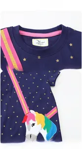 Detail of navy blue kids t-shirt with rainbow unicorn embroidery and golden star prints