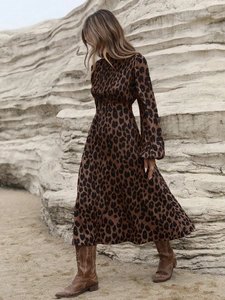 Detail of leopard print maxi dress with pleated collar and elegant lantern sleeves