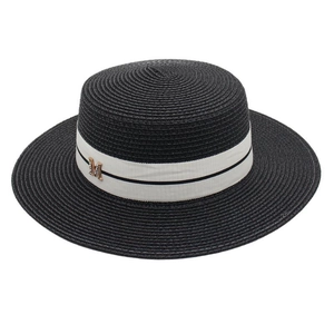 Detail of the woven texture and golden M letter on the black straw boater hat band