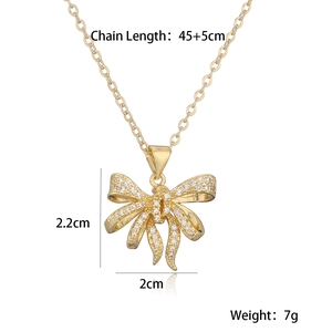 Detailed view of gold bow pendant necklace with dimensions and chain length 45+5cm