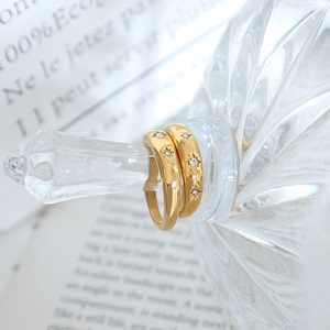 Minimalist 18K gold plated stainless steel star engraved rings with small white zircons