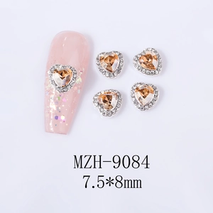 Macro shot of MZH-9084 heart crystal nail charms with silver accents and 7.5x8mm size
