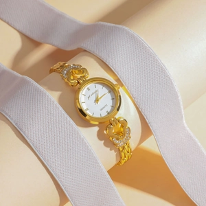 Elegant gold quartz watch for women with hollow heart strap and sparkling crystal accents