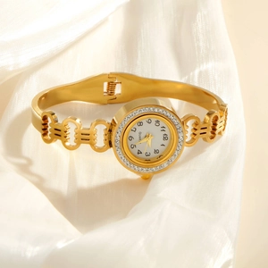 Elegant gold stainless steel bangle watch with zircon-set round dial on white silk fabric