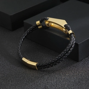 Men's leather braided bracelet with golden stainless steel geometric buckle on display box