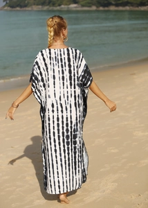 Detail of loose black and white vertical tie-dye kaftan beach cover-up maxi dress