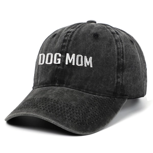 Close-up of white Dog Mom embroidery on vintage washed charcoal baseball cap fabric
