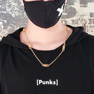 Minimalist gold titanium steel spring necklace shown on a model in street style fashion