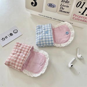 Detailed view of plaid cotton earphone case with delicate lace edges and snap closure