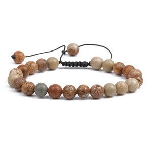 Handmade woven bracelet featuring natural tiger eye and turquoise stones with adjustable knot