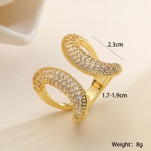 Detail view of gold irregular geometric open ring with shimmering zircon inlay