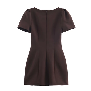 Dark brown puff sleeve dress with a pleated waist and A-line silhouette on white background