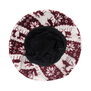 Top view of plush Christmas bucket hat with red reindeer and snowflake patterns