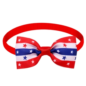 Detail of Independence Day dog bowtie with American flag stars and stripes on ribbed fabric