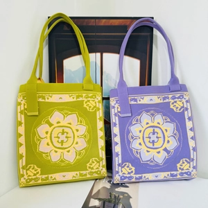 Detailed knit pattern on a retro geometric tote bag with lotus jacquard texture