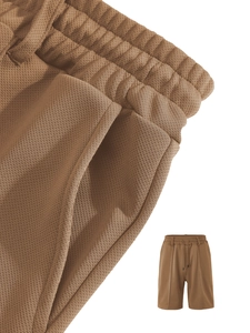 Detailed macro view of the brown elastic waistband and high-density waffle fabric texture